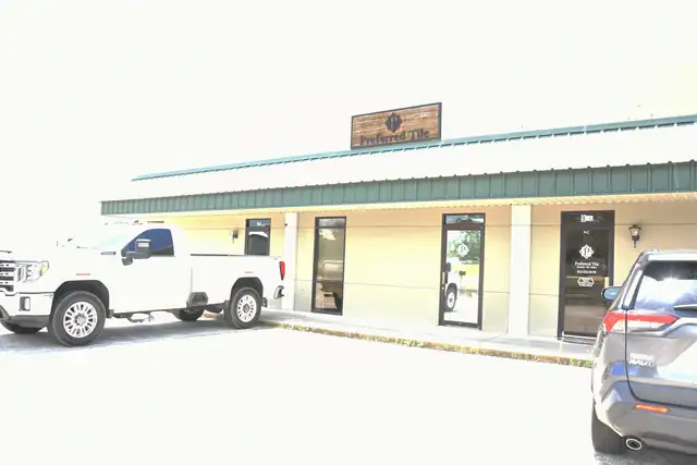 Preferred Tile storefront at 9 N Zetterower Ave in Statesboro with a white pickup truck parked outside